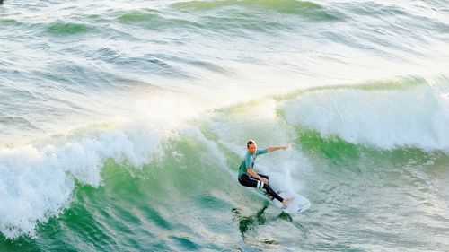 People surfing in sea