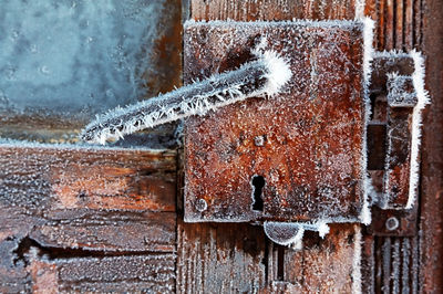 Close-up of frosted old door lock