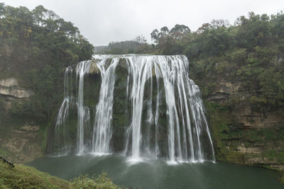 Scenic view of waterfall in forest