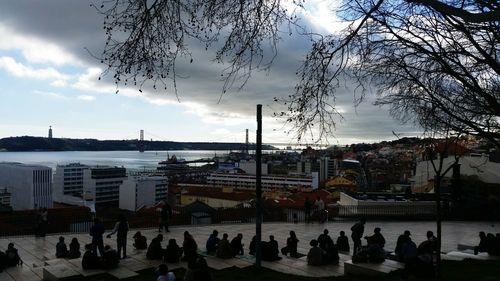 Buildings against cloudy sky