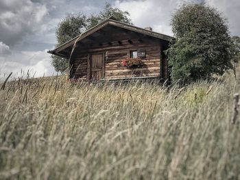 House on field against sky