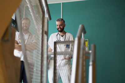 Doctors talking at hospital staircase