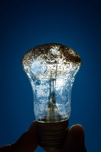 Close-up of water splashing against blue background