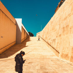 Low angle view of man against building