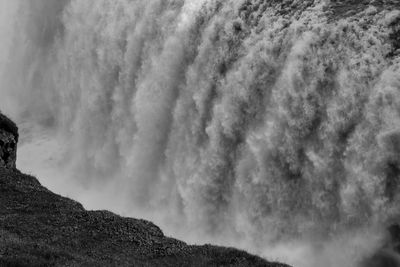 Low angle view of mountain against cloudy sky
