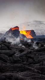 Scenic view of volcanic mountain against sky