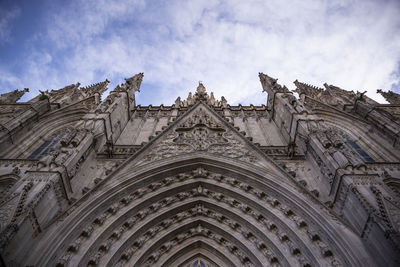 Low angle view of ornate building against sky