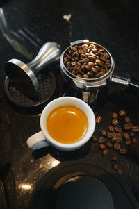 High angle view of coffee cup on table