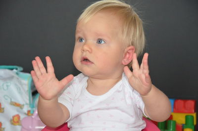 Close-up of cute baby looking away