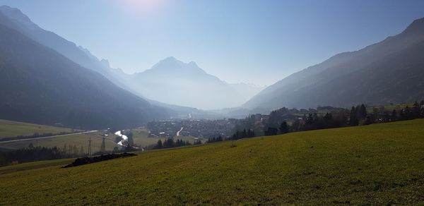 Scenic view of landscape and mountains against sky