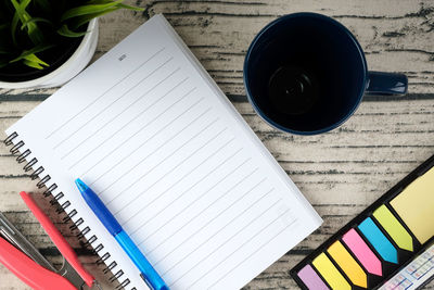 High angle view of pencil and book on table