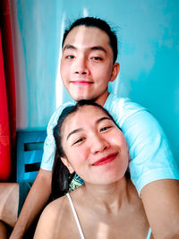 Portrait of smiling young man at home