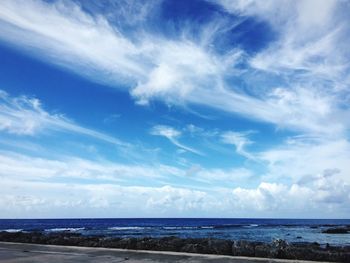 Scenic view of sea against cloudy sky