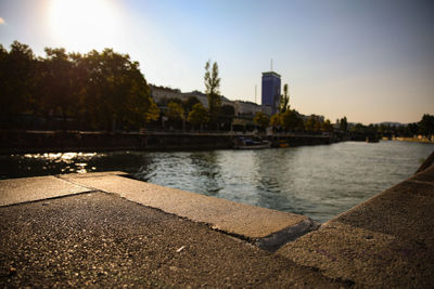 Scenic view of river against sky at sunset