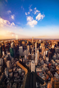 High angle view of cityscape against cloudy sky