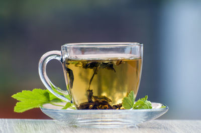 Close-up of tea in glass on table