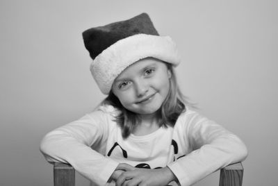 Portrait of smiling woman against white background