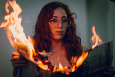 Portrait of woman with fire