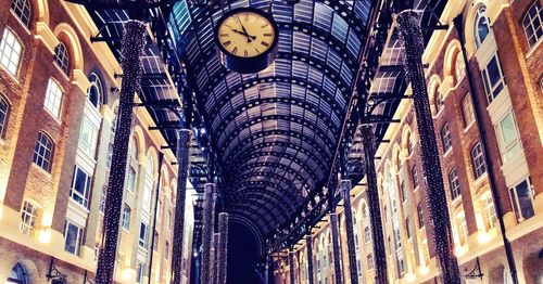 Low angle view of illuminated buildings in city