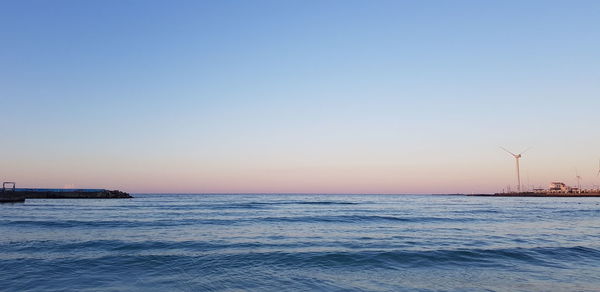 Scenic view of sea against clear sky during sunset