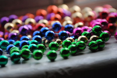 Close-up of colorful beads necklace on table