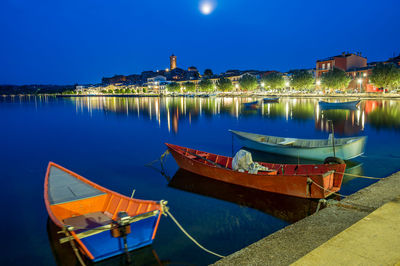 Nightview of the ancient village of marta, on the shore of bolsena lake in lazio, italy