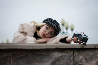 Portrait of woman relaxing on camera