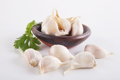 Close-up of garlic against white background