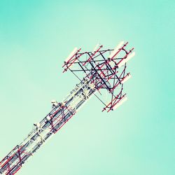 Low angle view of communications tower against clear sky