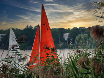 Scenic view of lake against orange sky