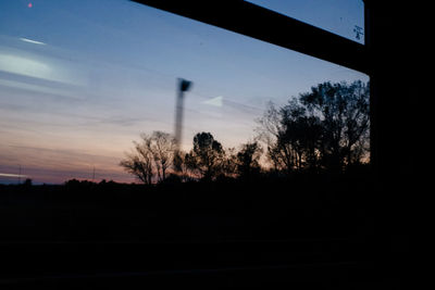 Silhouette trees against the sky