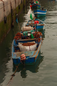 Boats moored at harbor