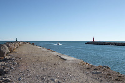 Scenic view of speedboat on sea against sky