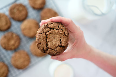 Close up biscuit in hand top view