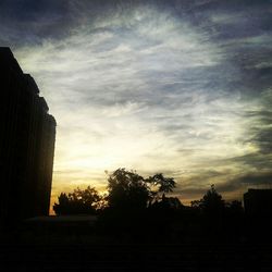 Built structure against sky at sunset