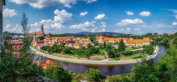 High angle view of river amidst buildings against sky