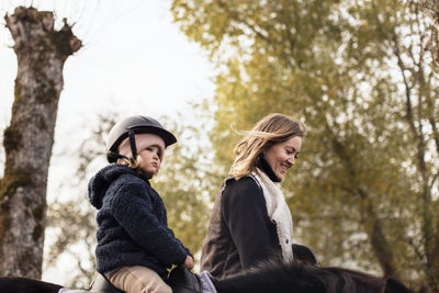 Mother and daughter during horse ride