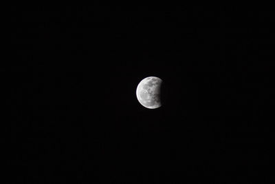 Low angle view of moon against sky at night
