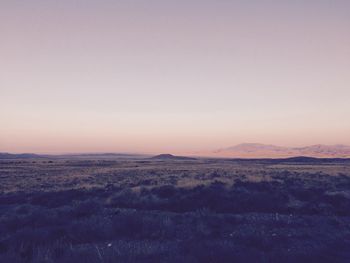 Scenic view of landscape against sky during sunset