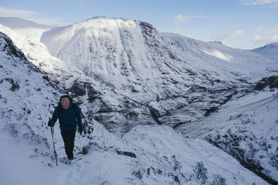 Man standing on snow covered mountain