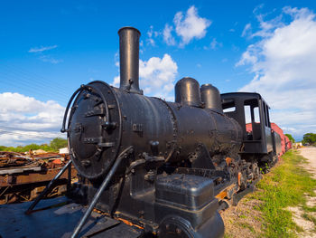 Steam train against sky