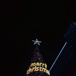 Low angle view of illuminated building at night