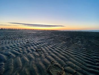 Scenic view of sea against clear sky during sunset