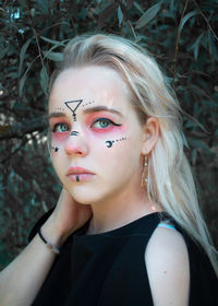 Portrait of a beautiful young woman outdoors