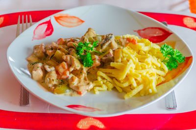 Close-up of served food in plate