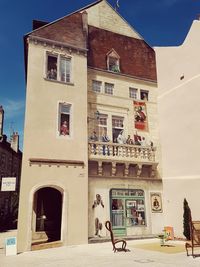 Exterior of buildings in city against sky