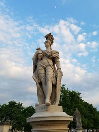 Low angle view of statue against sky