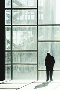 Reflection of people on glass window