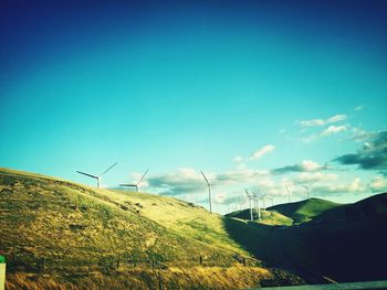 Scenic view of trees against clear blue sky