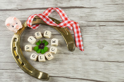 Close-up of horseshoe and christmas decorations on table